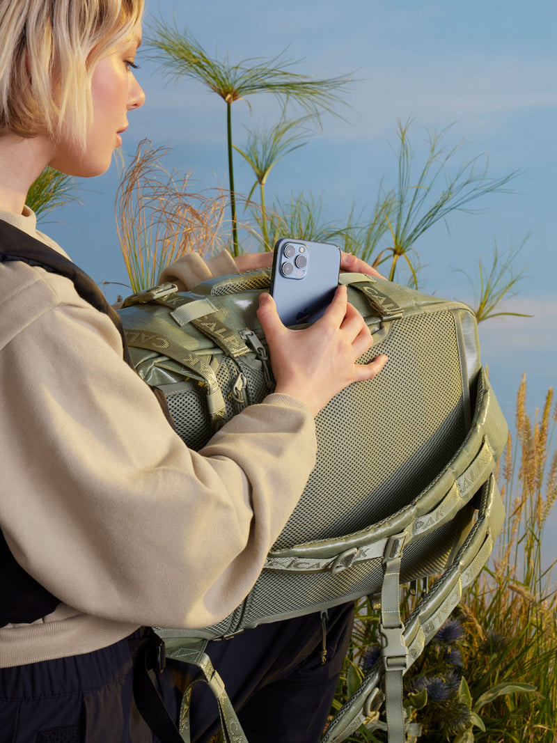 woman with CALPAK backpack duffel