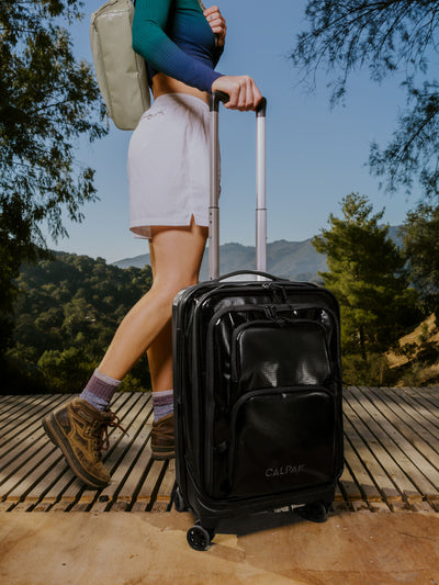 Studio product shot of front-facing CALPAK Terra Carry-On luggage with soft shell and 360 spinner wheels in obsidian; LTE1020-OBSIDIAN