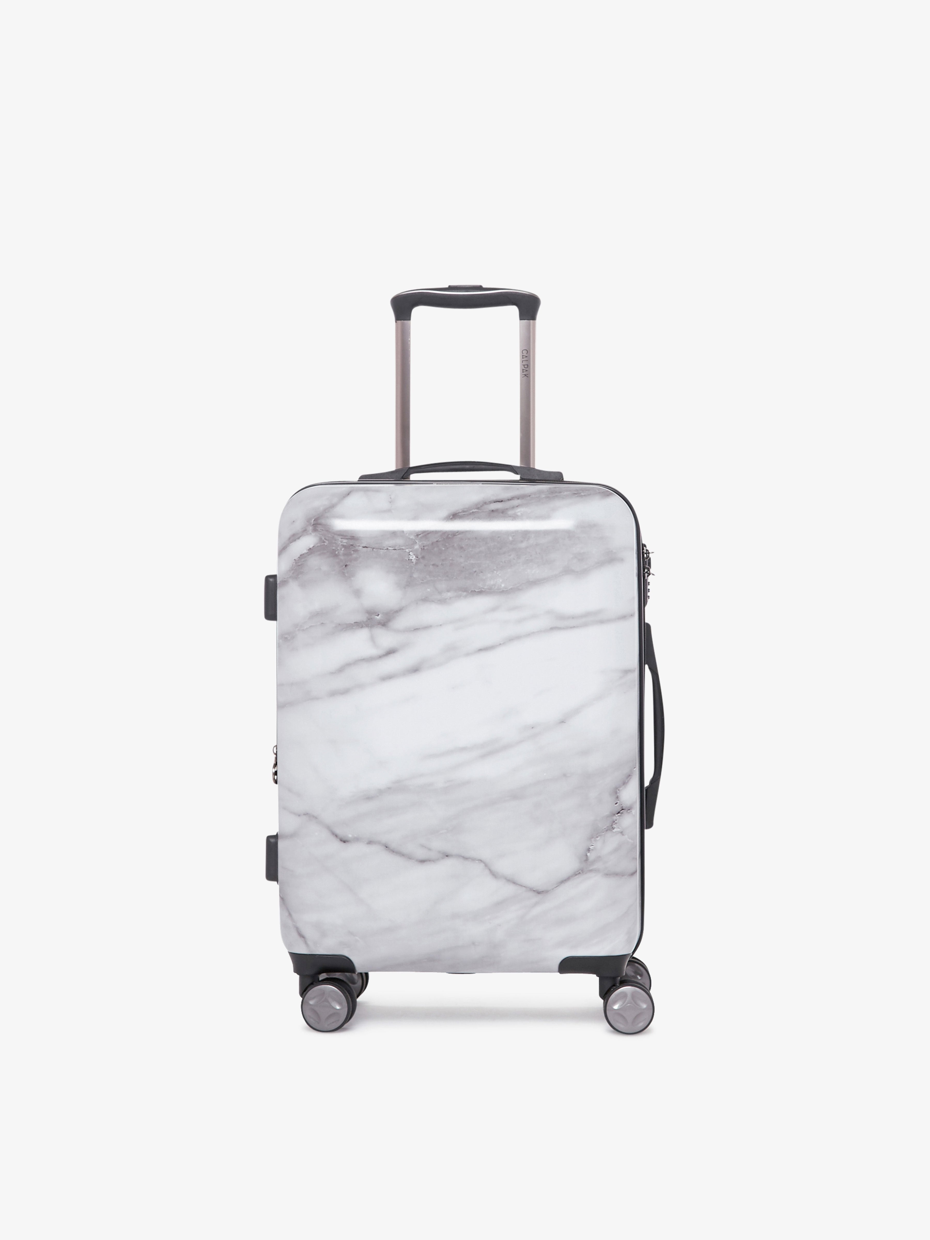 https://www.calpaktravel.com/cdn/shop/products/astyll-carry-on-luggage-milk-marble-front.jpg?v=1591829463&em-format=auto